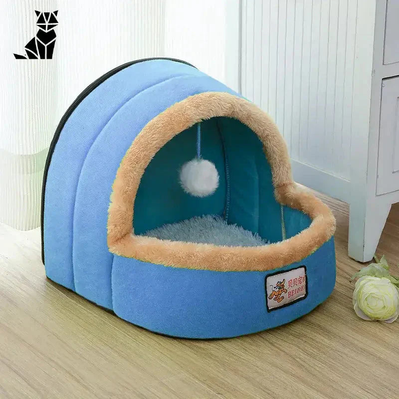 Coussin pour chien bleu avec boule blanche, parfait pour les chats à la recherche d’un espace personnel confortable